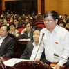 Đại biểu Quốc hội tỉnh Quảng Trị Lê Như Tiến chất vấn thành viên Chính phủ. (Ảnh: Lâm Khánh/TTXVN)