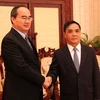 Thủ tướng Thongsinh Thammavong tiếp ông Nguyễn Thiện Nhân. (Ảnh: Hoàng Chương/Vietnam+)