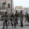 Lực lượng an ninh Israel được triển khai để đối phó với người biểu tình Palestine tại Bethlehem, Khu Bờ Tây ngày 13/10. (Nguồn: AFP/TTXVN)