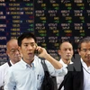 Nhà đầu tư theo dõi tỷ giá chứng khoán tại thủ đô Tokyo, Nhật Bản ngày 2/9. (Nguồn: AFP/TTXVN)