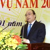 Phó Thủ tướng Nguyễn Xuân Phúc phát biểu tại hội nghị. (Ảnh: An Đăng/TTXVN) 