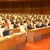 Các lãnh đạo, nguyên lãnh đạo Đảng và Nhà nước và các đại biểu tại phiên khai mạc. (Ảnh: Nhan Sáng/TTXVN)