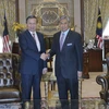 Bộ trưởng Tô Lâm và Phó Thủ tướng kiêm Bộ trưởng Nội vụ Malaysia Ahmad Zahid Hamidi. (Ảnh: Hoàng Nhương/Vietnam+)