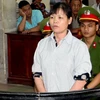 Bị cáo Cấn Thị Thêu trước vành móng ngựa trong phiên tòa năm 2014. (Ảnh: Phạm Kiên/ TTXVN)