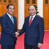 Thủ tướng Nguyễn Xuân Phúc tiếp ông Suphan Keomisay, Bộ trưởng Bộ Kế hoạch và Đầu tư Lào đang ở thăm và làm việc tại Việt Nam. (Ảnh: Thống Nhất/TTXVN)