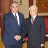 Tổng Bí thư Nguyễn Phú Trọng tiếp Tổng Bí thư Đảng Cộng sản Hy Lạp Dimitrios Koutsoumpas đang thăm và làm việc tại Việt Nam. (Ảnh: Trí Dũng/TTXVN) 