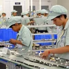 Dây chuyền sản xuất tại Công ty TNHH Yokowo Vietnam (vốn đầu tư của Nhật Bản) ở khu công nghiệp Đồng Văn II, Hà Nam. (Ảnh: Danh Lam/TTXVN).