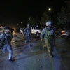 Lực lượng an ninh Afghanistan tới hiện trường vụ đánh bom. (Nguồn: AP)