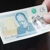 Đồng tiền polymer mệnh giá 5 bảng. (Nguồn: Getty Images)
