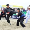 Vận động viên Vũ Văn Kiên thắng vận động viên Jacizen Abad trong trận chung kết đối kháng hạng cân 55 kg nam. (Ảnh: Quốc Khánh/TTXVN)