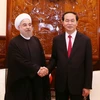 Chủ tịch nước Trần Đại Quang đón Tổng thống Cộng hòa Hồi giáo Iran Hassan Rouhani. (Ảnh: Nhan Sáng/TTXVN)