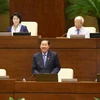 Bộ trưởng Bộ Nội vụ Lê Vĩnh Tân giải trình ý kiến của đại biểu Quốc hội về dự án Luật về Hội. (Ảnh: Doãn Tấn/TTXVN)
