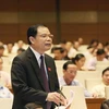 Bộ trưởng Bộ Nông nghiệp và Phát triển nông thôn Nguyễn Xuân Cường giải trình và làm rõ các vấn đề đại biểu Quốc hội nêu. (Ảnh: Phương Hoa/TTXVN)