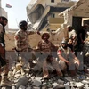 Lực lượng trung thành với Chính phủ Lybia trong chiến dịch truy quét phiến quân IS tại thành phố Sirte ngày 14/10. (Nguồn: AFP/TTXVN)