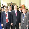 Chủ tịch nước Trần Đại Quang với các đại biểu tham dự buổi lễ. (Ảnh: Nhan Sáng/TTXVN)