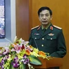 Trung tướng Phan Văn Giang, Ủy viên Trung ương Đảng, Tổng Tham mưu trưởng Quân đội nhân dân Việt Nam phát biểu tại hội nghị. (Ảnh: An Đăng/TTXVN)