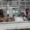 Người dân Syria sơ tán khỏi thành phố Aleppo ngày 22/12. (Nguồn: AFP/TTXVN)