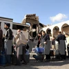 Người dân Syria xếp hàng chờ mua gas trong không khí yên bình ở Damascus ngày 30/12. (Nguồn: EPA/TTXVN)