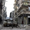 Binh sỹ quân đội Chính phủ Syria sau khi giành lại quyền kiểm soát thành phố Aleppo ngày 23/12. (Nguồn: EPA/TTXVN)