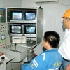 Lao động Trung Quốc làm việc trên công trường xây dựng lò giếng đứng mức - 300 mét, Công ty than Hà Lầm. (Ảnh: Nguyễn Đán/TTXVN)
