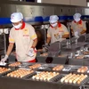 Dây chuyền sản xuất trứng sạch tại thành phố Hồ Chí Minh. (Ảnh: Hoàng Hải/TTXVN)
