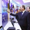 Thủ tướng Nguyễn Xuân Phúc trong một buổi làm việc với Tập đoàn Bưu chính Viễn thông Việt Nam và dự lễ khai trương dịch vụ di động vệ tinh Vinaphone-S. (Nguồn: TTXVN)
