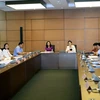 Đại biểu Quốc hội tỉnh Ninh Bình, Phú Thọ, Bình Thuận, Cần Thơ thảo luận ở tổ. (Ảnh: Nguyễn Dân/TTXVN)