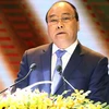 Thủ tướng Nguyễn Xuân Phúc dự và phát biểu tại hội nghị.(Ảnh: Thống Nhất/TTXVN)