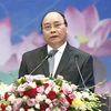 Thủ tướng Nguyễn Xuân Phúc chủ trì Hội nghị Thủ tướng Chính phủ với doanh nghiệp 'Đồng hành cùng doanh nghiệp' năm 2017. (Ảnh: Thống Nhất/TTXVN)