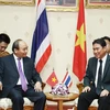 Thủ tướng Nguyễn Xuân Phúc gặp ông Somchai Vitdumrong, Tỉnh trưởng tỉnh Nakhon Phanom. (Ảnh: Thống Nhất/TTXVN)