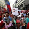 Những người ủng hộ Chính phủ Venezuela tuần hành ở Caracas ngày 9/7. (Nguồn: THX/TTXVN)