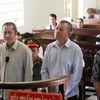Các bị cáo Thanh (phải), Lân (giữa) và Thành tại phiên tòa, (Ảnh: Thanh Tân/TTXVN)