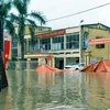Đường vào một số trụ sở cơ quan tại huyện Định Hóa bị ngập sâu. (Ảnh Thu Hằng/TTXVN)