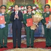 Chủ tịch nước Trần Đại Quang trao Quyết định thăng quân hàm cho ba sỹ quan cao cấp. (Ảnh: Nhan Sáng/TTXVN)