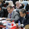 Bộ trưởng Thương mại quốc tế Canada Francois-Philippe Champagne (bên phải) dự Hội nghị Bộ trưởng TPP. (Ảnh: TTXVN)