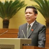 Bộ trưởng Bộ Giao thông Vận tải Nguyễn Văn Thể giải trình, tiếp thu ý kiến của đại biểu Quốc hội. (Ảnh: Phương Hoa/TTXVN)