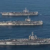 Tàu sân bay USS Ronald Reagan, Theodore Roosevelt và Nimitz của Mỹ tham gia một cuộc tập trận. (Nguồn: Yonhap/TTXVN)