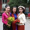 Lưu học sinh và cô giáo tại Học viện Báo chí và Tuyên truyền. (Ảnh: Vietnam+) 
