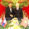 Tổng Bí thư Nguyễn Phú Trọng đón Tổng Bí thư, Chủ tịch nước Lào Bounnhang Vorachith. (Ảnh: Trí Dũng/TTXVN)