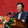 Phó Thủ tướng, Bộ trưởng Bộ Ngoại giao Phạm Bình Minh đến dự và phát biểu tại Hội nghị. (Ảnh: Nguyễn Khang/TTXVN)