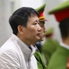 Bị cáo Trịnh Xuân Thanh và các đồng phạm nghe tòa tuyên án. (Ảnh: Doãn Tấn/TTXVN)