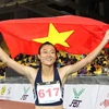 Vận động viên Lê Tú Chinh (Việt Nam) ăn mừng sau khi về đích đoạt huy chương vàng tại SEA Games 29. (Ảnh: Quốc Khánh/TTXVN)
