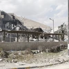 Cảnh đổ nát tại tòa nhà của Trung tâm nghiên cứu khoa học Syria ở quận Barzeh, phía bắc Damascus sau cuộc tấn công của Mỹ, Anh, Pháp ngày 14/4. (Nguồn: AFP/ TTXVN)
