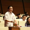 Bộ trưởng Bộ Tài nguyên và Môi trường Trần Hồng Hà phát biểu giải trình một số ý kiến đại biểu Quốc hội nêu. (Ảnh: Dương Giang/TTXVN)