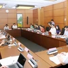 Đại biểu Quốc hội các tỉnh Tiền Giang, Nam Định, Quảng Ngãi thảo luận ở tổ. (Ảnh: Nguyễn Dân/TTXVN)