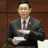 Phó Thủ tướng Vương Đình Huệ trả lời chất vấn của Đại biểu Quốc hội. (Ảnh: Văn Điệp/TTXVN)