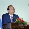 Thủ tướng Nguyễn Xuân Phúc phát biểu tại cuộc toạ đàm. (Ảnh: Thống Nhất/TTXVN)