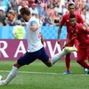 Tiền đạo Harry Kane (trái) thực hiện cú đá nâng tỷ số lên 5-0 cho đội tuyển Anh trước Panama. (Nguồn: AFP/TTXVN)