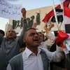 Người biểu tình phản đối chính sách xã hội tại quảng trường Tahrir, thủ đô Baghdad, Iraq ngày 16/7. (Ảnh: AFP/TTXVN)