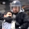 Hình ảnh được cho là ông Alexandre Benalla đang hành hung người biểu tình. (Nguồn: BBC)